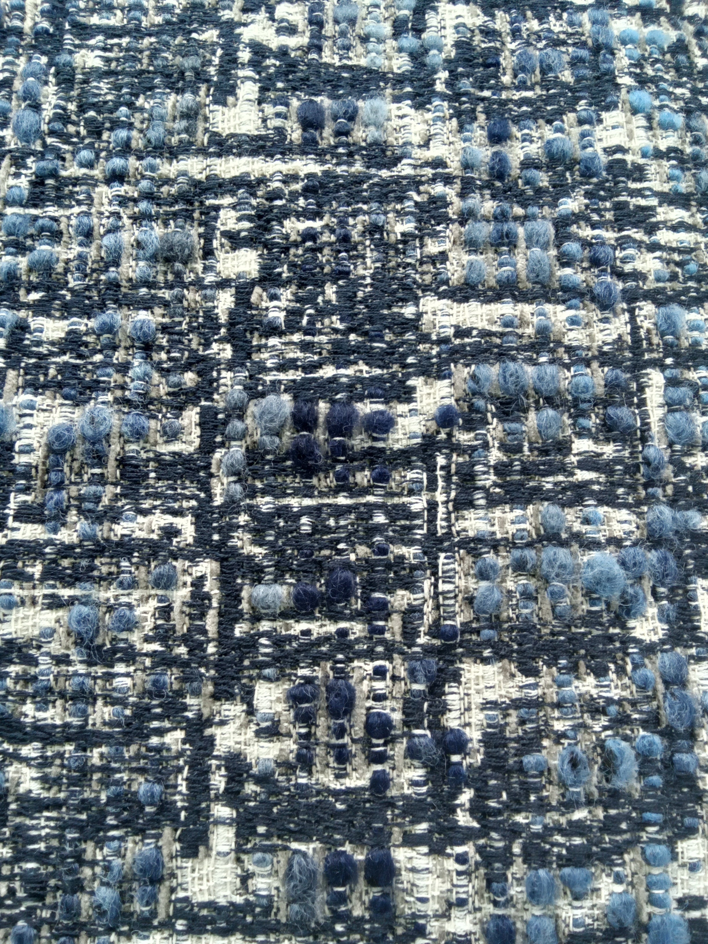 Close-up of blue and white pillow design