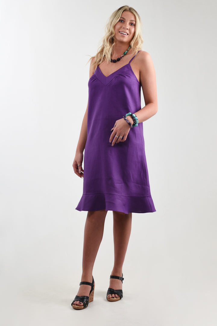 Model showcasing a purple linen flounce dress