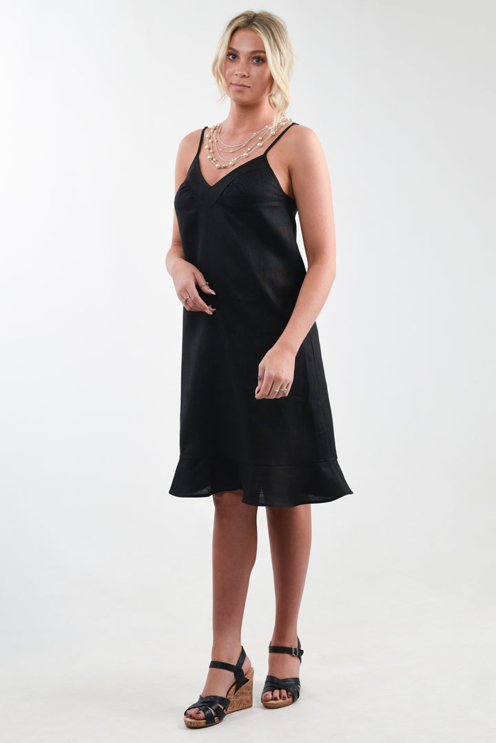 Model wearing a black linen flounce dress