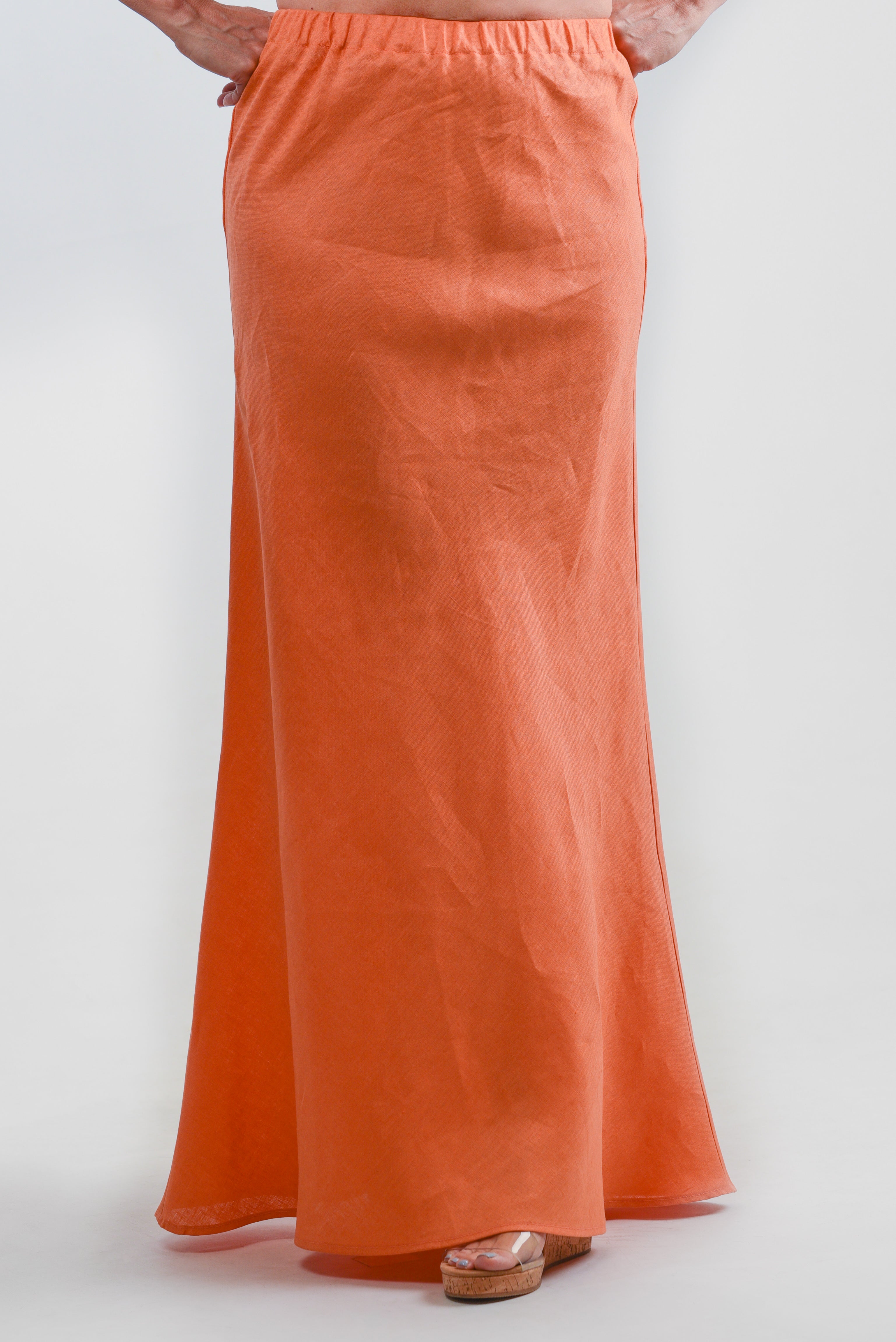 Model wearing an orange maxi skirt