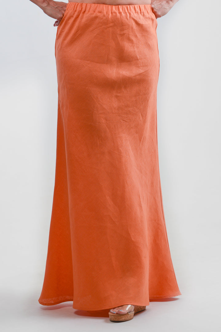 Model wearing an orange maxi skirt