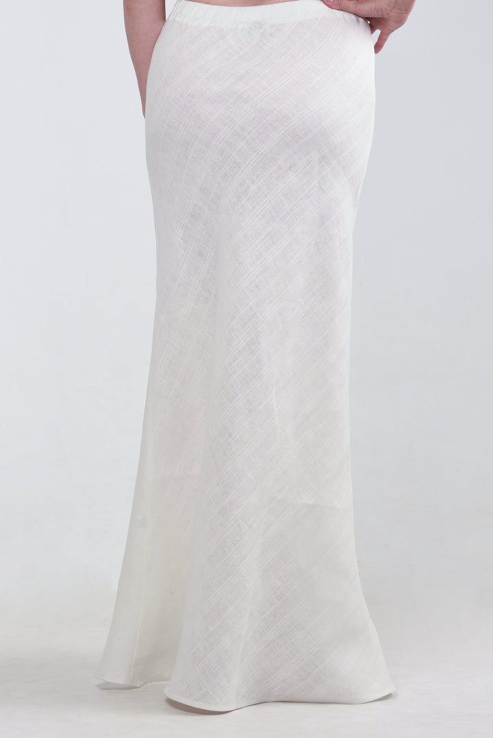 Model wearing a white maxi skirt