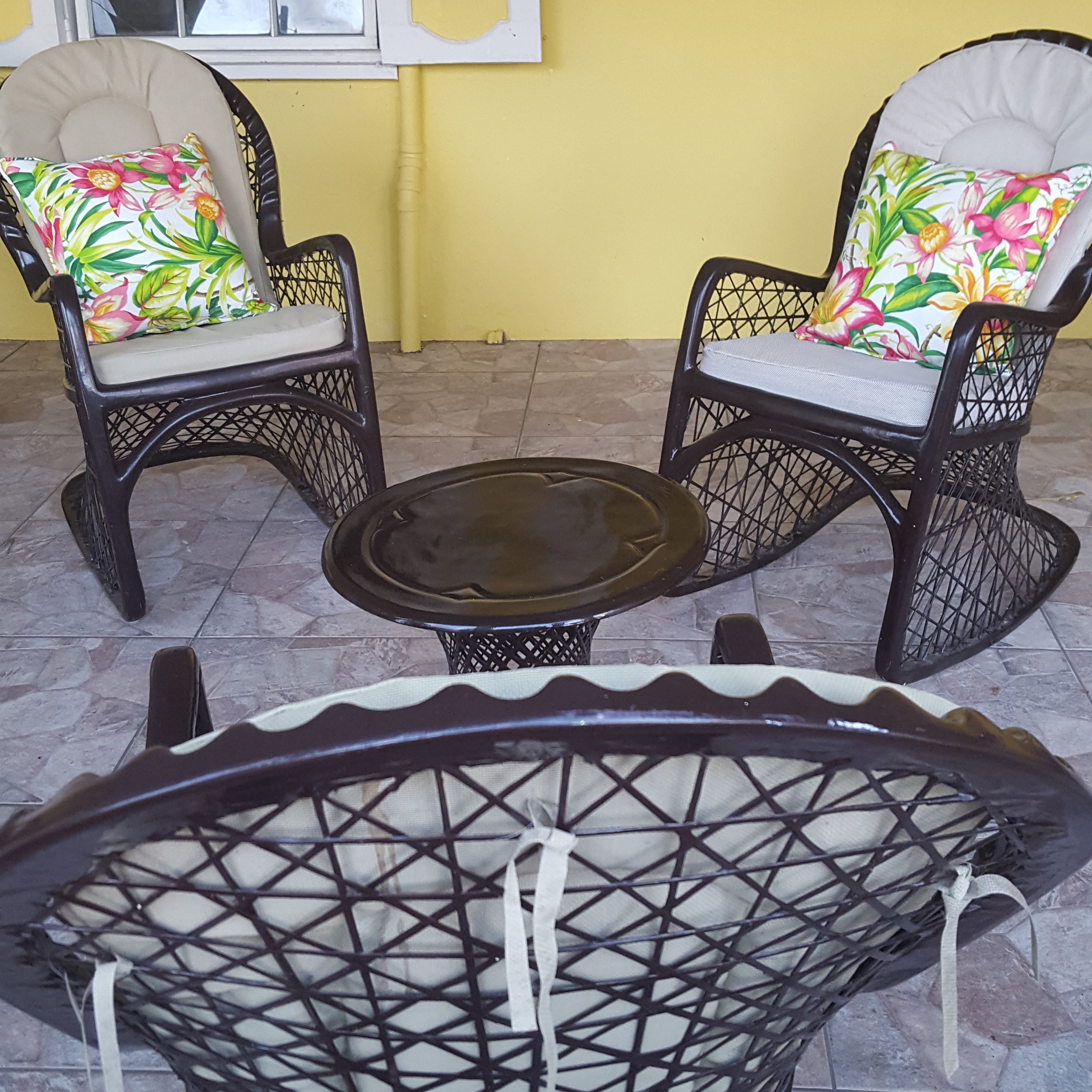 Patio chairs with botanical pillow cover