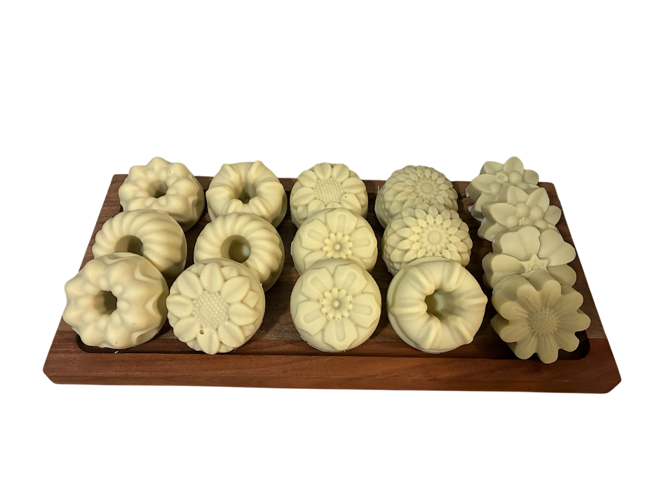 Flower-shaped gentle shea butter on a wooden board