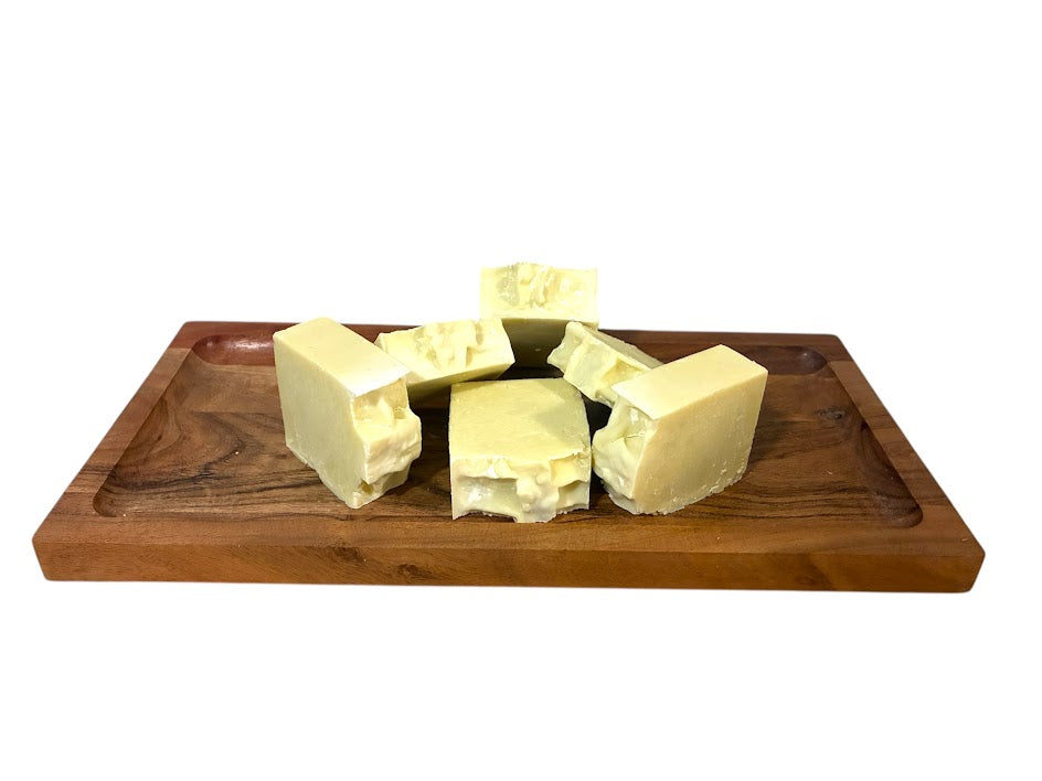 Blocks of gentle shea butter on a wooden tray